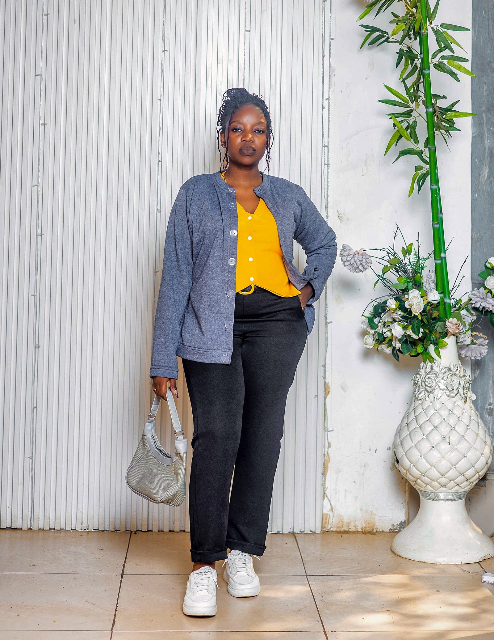Blue cardigan with black trousers
